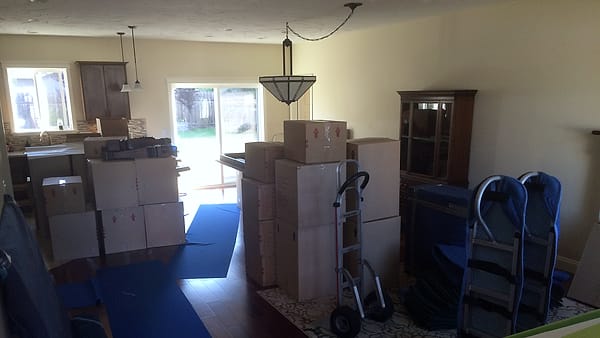 Sealed cardboard boxes stacked and taped shut, packed and ready to be moved out
