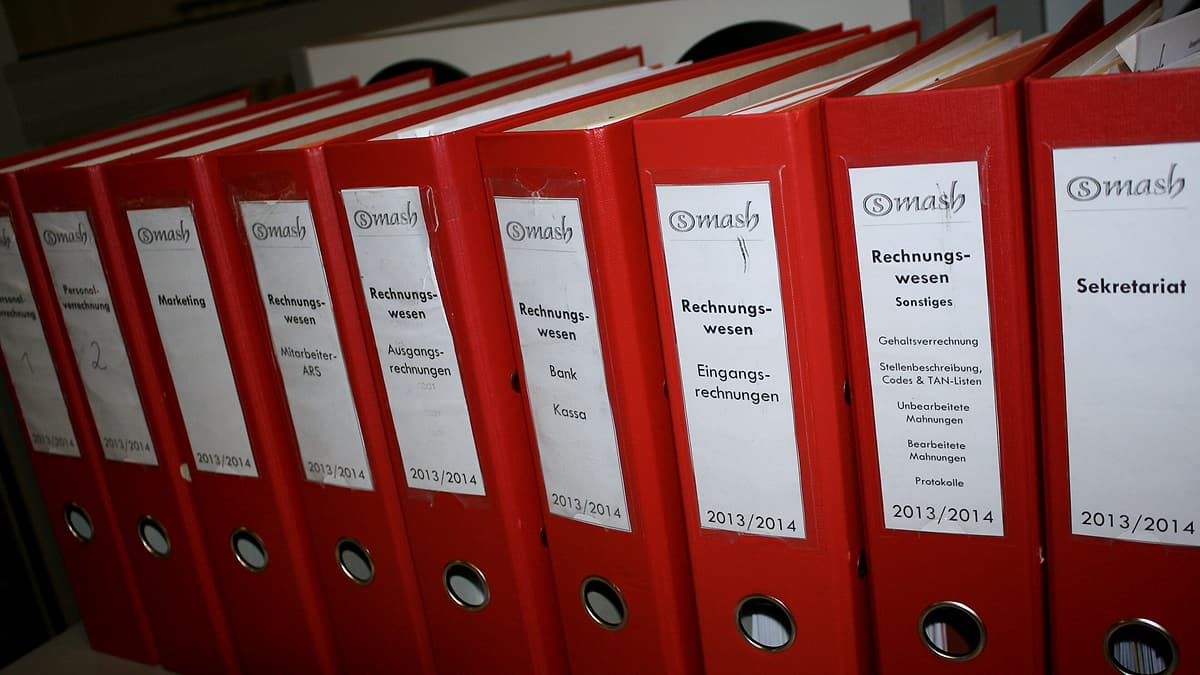 Colored document folders stacked together with their tabs facing outward