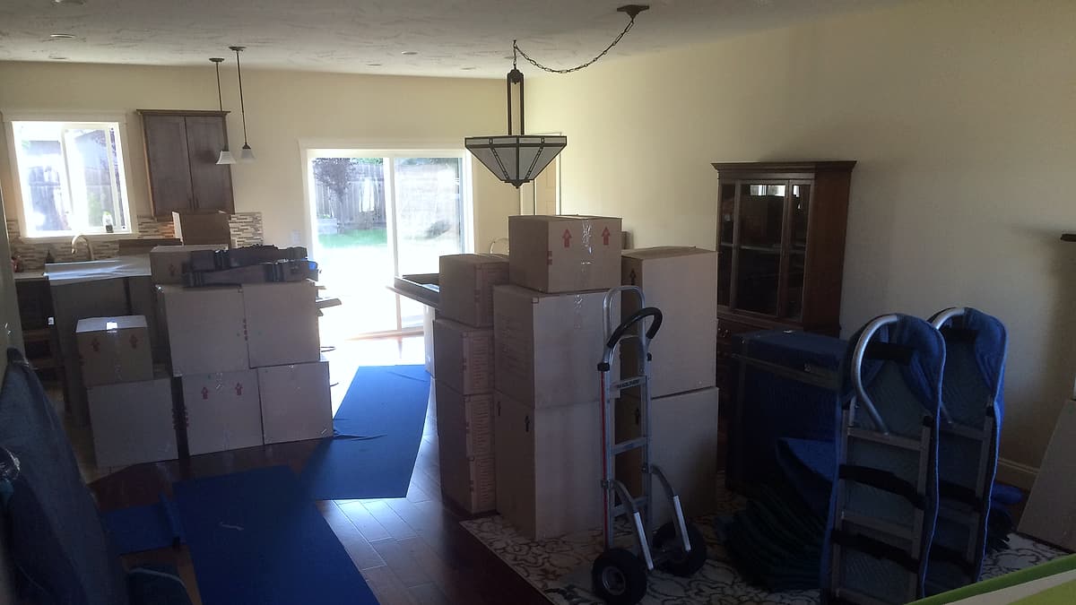 Sealed cardboard boxes stacked and taped shut, packed and ready to be moved out
