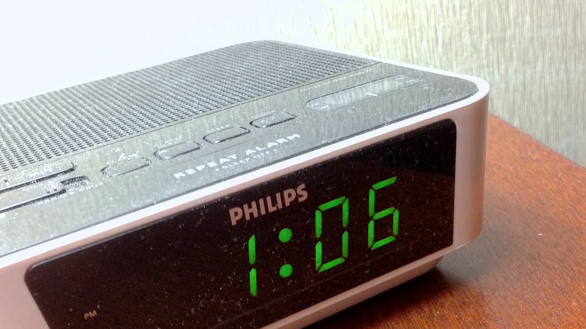 A seven-segment display showing the time in glowing numerals against the dark